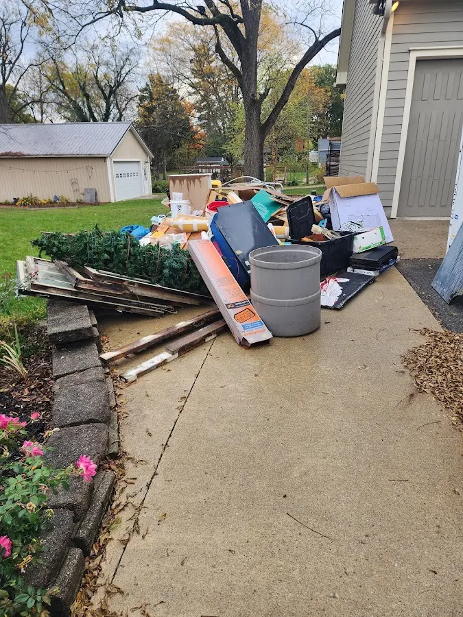 Dumpster being loaded with debris for Commercial Dumpster Rental in Millbrae